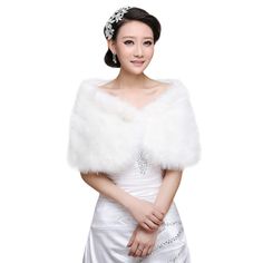 a woman in a white wedding dress and fur stole