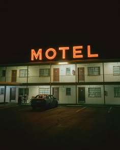 the motel is lit up at night time