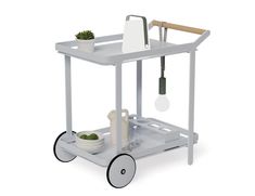 a white cart with a potted plant and utensils on it