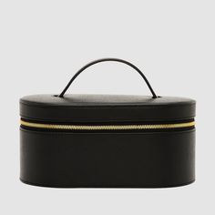 Crafted from our luxurious, textured Recycled Saffiano Leather (outer) and smooth nylon lining (interior), the Essential Vanity Case is a durable, reinforced leather case designed with gold hardware for added elegance. A separate pouch is also included to store your prized possessions, and elastic straps on the lid can securely hold your makeup brushes in place. Dimensions: 11cm (H) x 22cm (W) x 13cm (D) Pictured here: Our "Serif" font in size 24pt, in Gold.SKU code: VANITCSE-RS-BLA-GO-1-WKMDuri Luxury Makeup Bag, Vanity Bag, Vanity Case, Jet Setter, Luxury Makeup, Recycled Leather, Excuse Me, Makeup Bags, Makeup Case