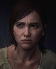 a woman with freckled hair and blue eyes stares at the camera in a screenshot