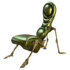 a green chair that is shaped like a human body with legs and arms, sitting on it's side