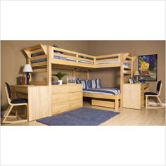 a bedroom with bunk beds and desks in the corner, along with a rug on the floor