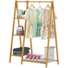 a wooden rack with clothes and shoes on it