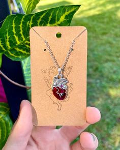 This deep red heart pendant steals the show suspended from the it's shiny silver chain ❤️🔒 * Lifelike anatomical silver heart pendant * Veins, arteries, chambers * Handmade by a local NJ artist Red Heart-shaped Sterling Silver Charm Necklace, Anatomical Heart Pendant, Red Heart Pendant, Anatomical Heart Necklace, Anatomical Heart, Silver Heart Pendant, Shiny Silver, Silver Heart, Deep Red