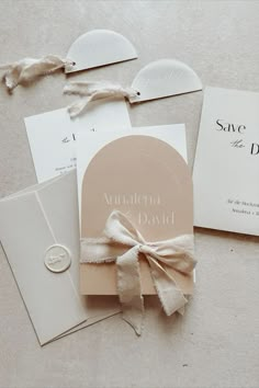 the wedding stationery is laid out on the floor