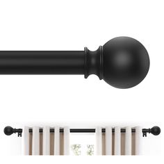 the curtain rod is black and has a ball on it