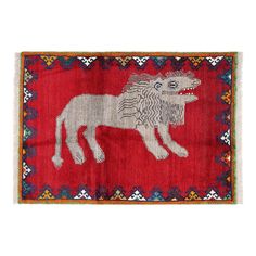 a red rug with a white dog on it