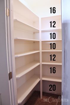 an empty closet with numbers on the bottom shelf and two rows of shelves in front