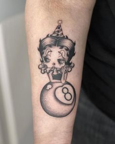 a woman with a birthday hat on her head sitting on top of a ball tattoo