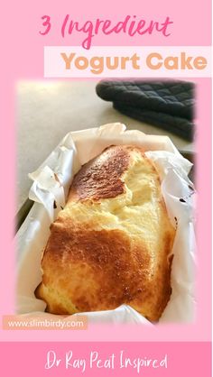 a piece of bread sitting on top of a white paper in a pink box with the words 3 ingredient yogurt cake