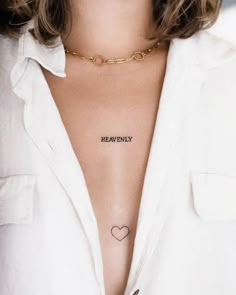 a woman's chest with the words heavenly tattooed on her left side ribcage