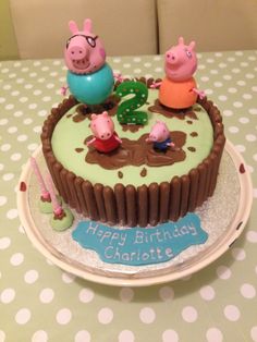 a peppa pig birthday cake on a table