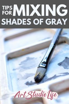 an art studio tray with paint brushes and the title tips for mixing shades of gray