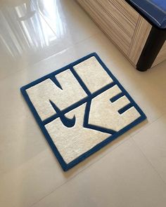 a blue and white rug on the floor in a room