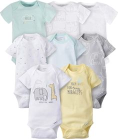 six baby onesuits in various colors and sizes, all with the same design on them