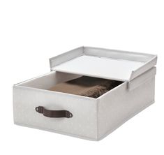 an open storage box with clothes in it