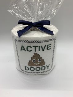 an active doody toilet paper roll wrapped in plastic