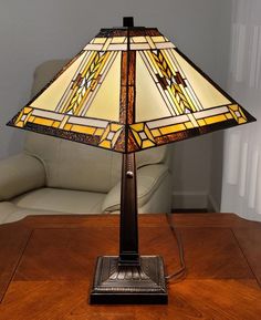 a lamp sitting on top of a wooden table