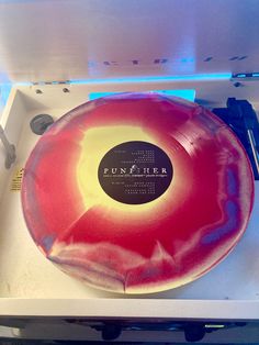 Picture of the vinyl punisher by Phoebe Bridgers on a record player. The record itself is the font explosion pricing side, a a marbling of red and yellow colors. Punisher Vinyl Phoebe, Phoebe Bridgers Vinyl, Punisher Vinyl, Phoebe Core, Pump Organ, Cd Aesthetic, Baritone Guitar