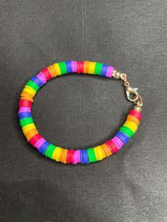 a multicolored bracelet on a gray background