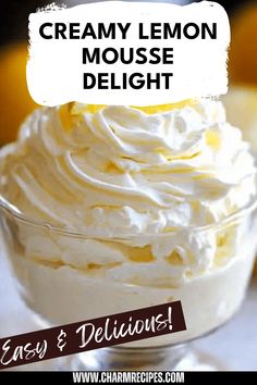 a close up of a dessert in a glass bowl with whipped cream on top and the words creamy lemon mousse delight below