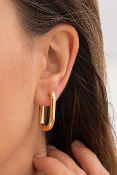 Some would say an outfit is not complete without your hoop earrings. Darcy is the ideal statement pair to match any painstakingly picked out dress, any 'jeans and a nice top'; even any bikini and a lilo in a swimming pool. There's no excuse not to rock these in every situation. Hoop length : 3cm Metals : 24k Gold Plated Silver ~ All metals used in these pieces are hypoallergenic and nickel free ~ Every order comes in a gold embossed protective jewellery box ~ All packaging is eco friendly and recycled Layering Earrings, Out Dress, Jewelry Earrings Hoops, Gold Plated Silver, Swimming Pool, Ear Cuff, Jewelry Box, 18k Gold, Gold Plate