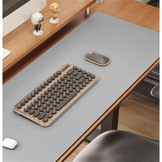 a computer desk with a keyboard and mouse