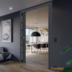 a living room filled with furniture and a painting on the wall above it's glass door