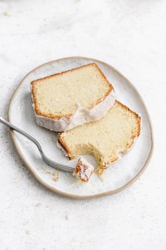 two slices of cake on a plate with a fork