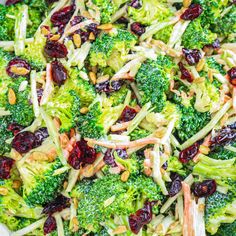 broccoli salad with cranberries and almonds in a white bowl