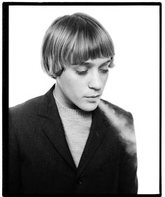 black and white photograph of a young man with short hair