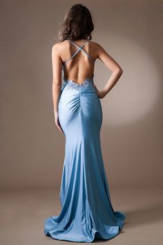 the back of a woman in a blue dress