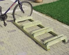 a bike is parked next to a wooden step