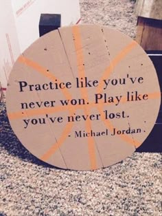 a wooden sign that says practice like you've never won play like you've never lost