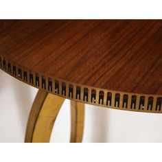 a close up of a wooden table with metal trimmings on the top and bottom