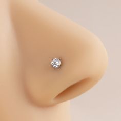 a close up view of a fake breast with a diamond in it's center