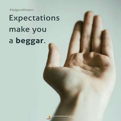 a hand with the words expectations make you a beggar