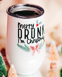 a white coffee mug with merry drunk i'm christmas written on it