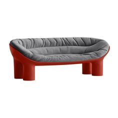 a red and grey dog bed on a white background