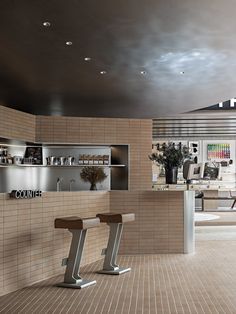 the interior of a store with two stools