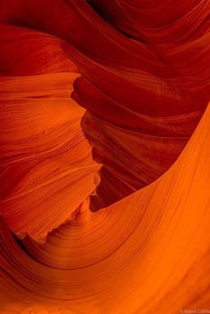 an orange and red rock formation with very thin lines in the center, as seen from above