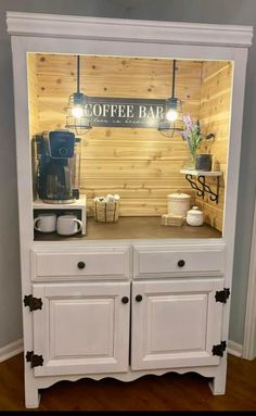 a coffee bar built into the side of a cabinet