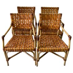 two chairs made out of bamboo sitting next to each other