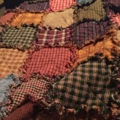 an old patchwork quilt that has been made into a blanket