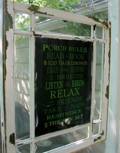 an old window with some writing on it