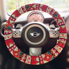 the steering wheel cover is decorated with colorful designs