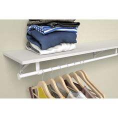 a white shelf with clothes hanging on it