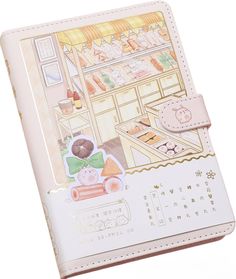 an open planner book with pictures of food items on the cover and writing in chinese