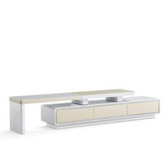 a white coffee table with two drawers on it